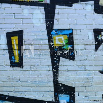 Image de Fragment of graffiti drawings The old wall decorated with paint stains in the style of street art culture Colored background texture